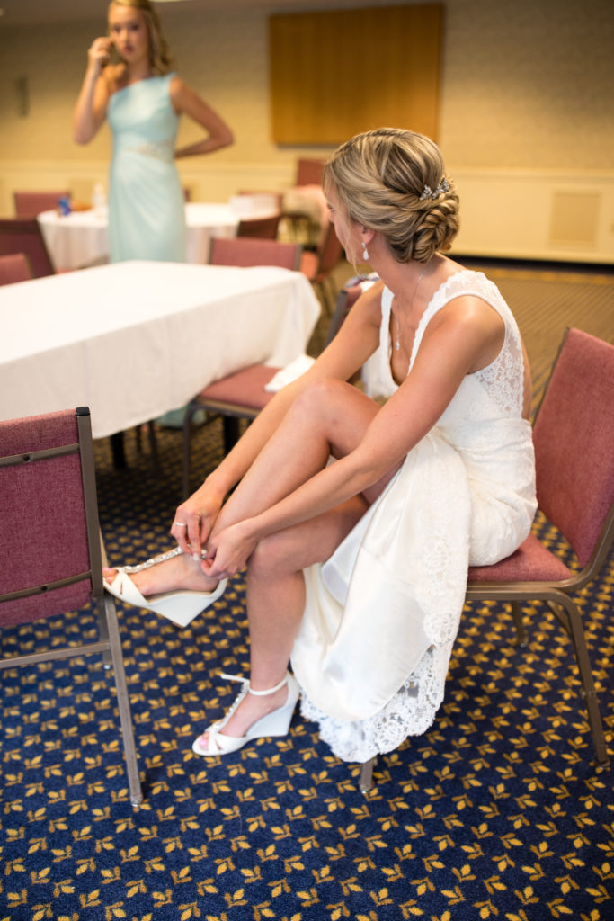 Bride putting on her shoes