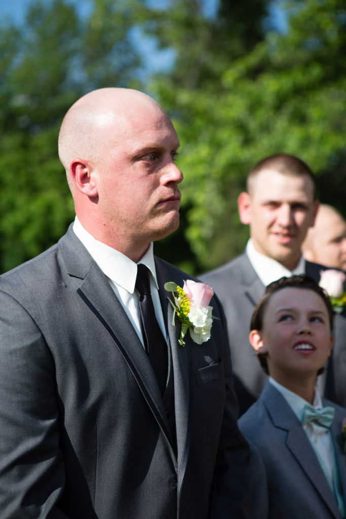 groom tearing up as bride walks down the aisle
