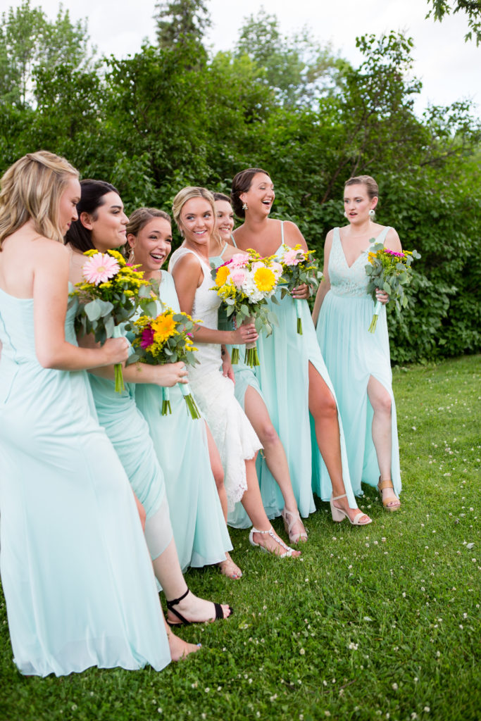 bride and her bridesmaids with leg out of slits