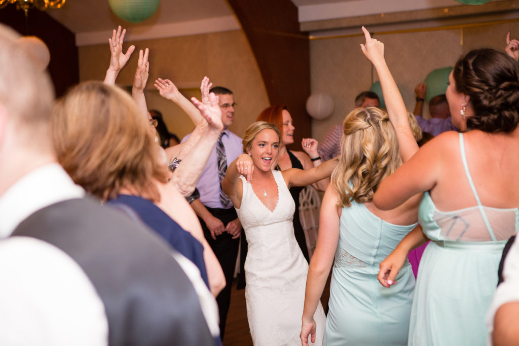 Bride surrounded on the dance floor 