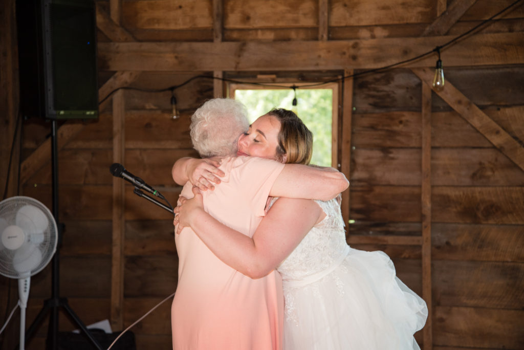 Bride hugging her memere after grace