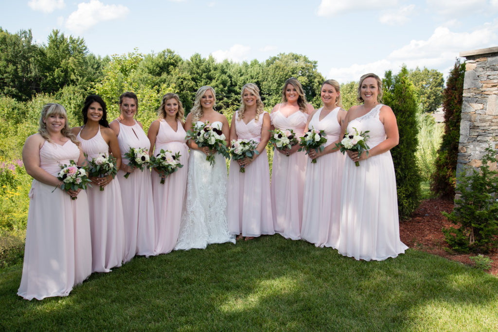 Bride with her girls outside standing in a line