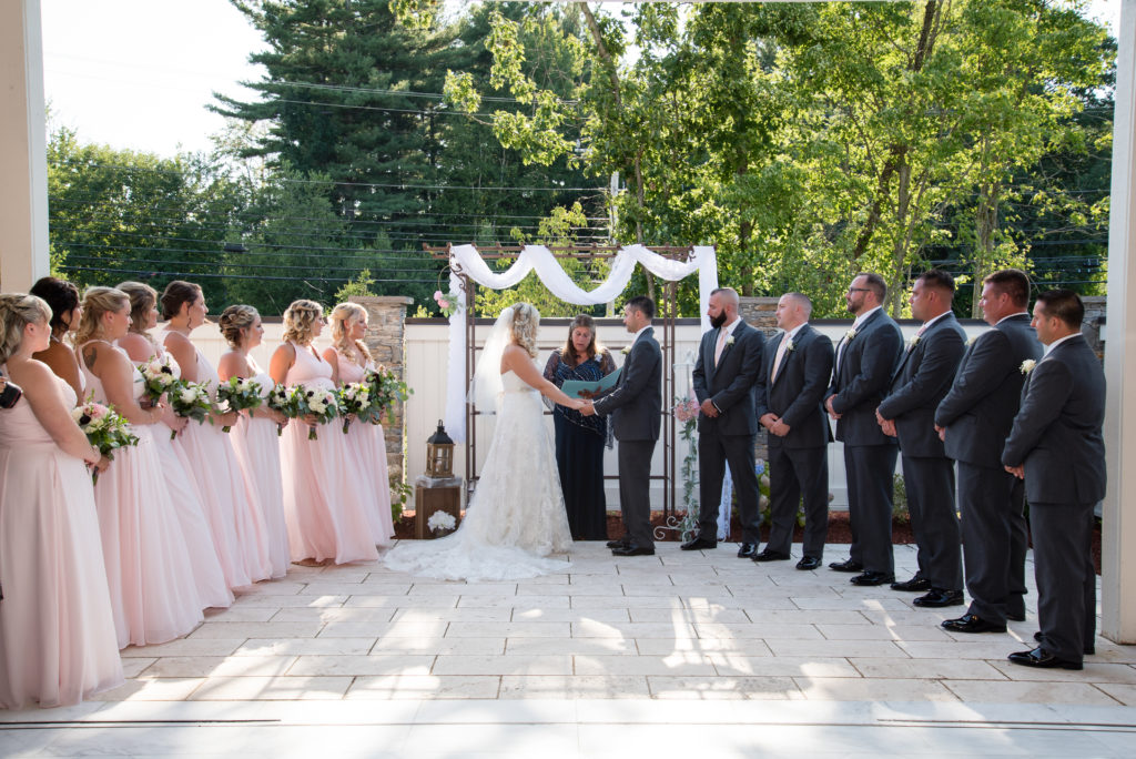 whole bridal party at the alter