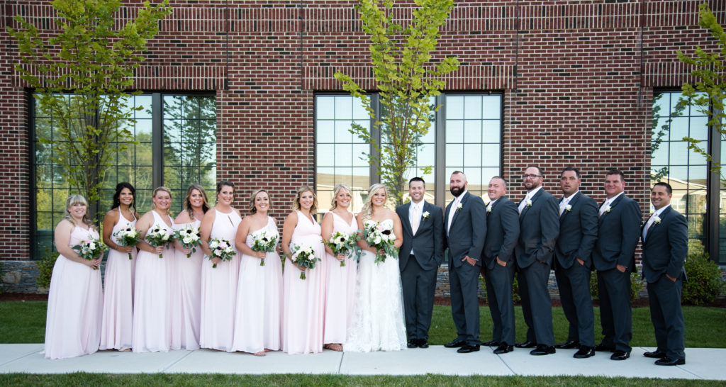 whole bridal party standing for a photo