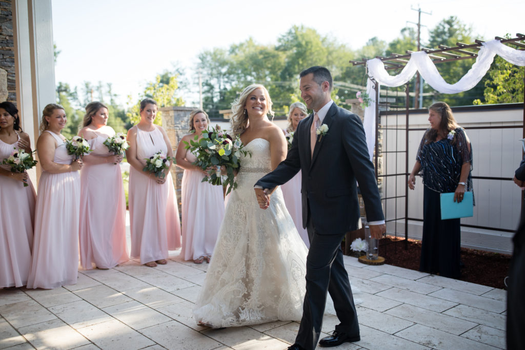 walking down the aisle as bride and groom for the first time