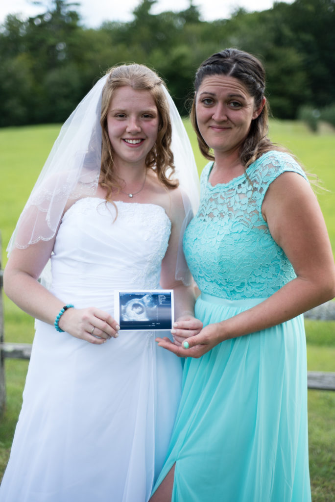 bride and her sister in law with ultrasound picture