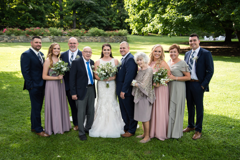 Bride's family with siblings, parents, and grandparents