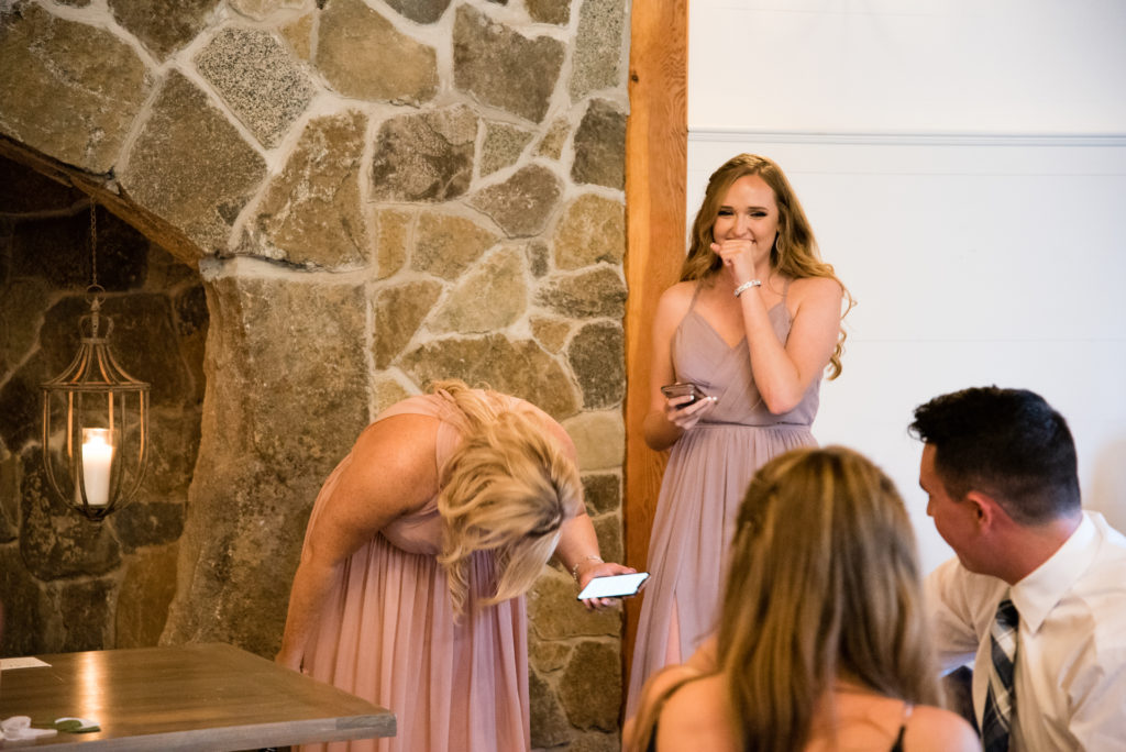 bridesmaids (brides sisters) laughing during speech