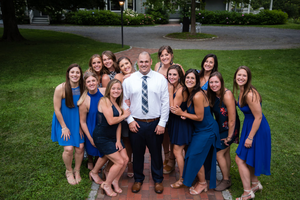 Groom with all the blue dressed girls