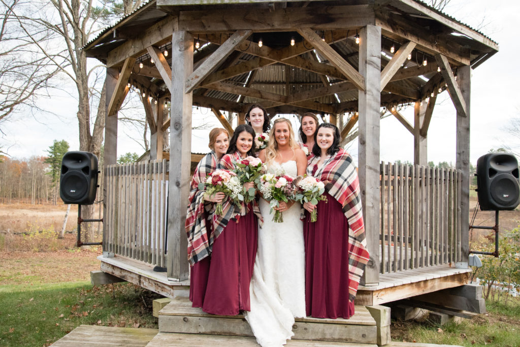 the bride with her ladies in the gazebo