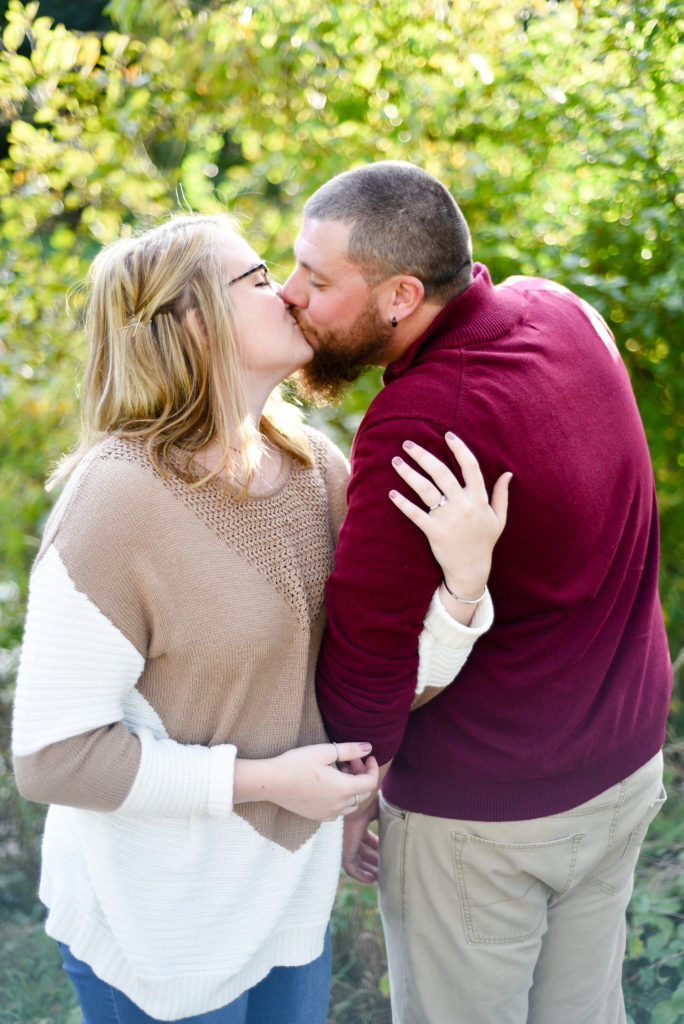 bride and groom kissing engagement session