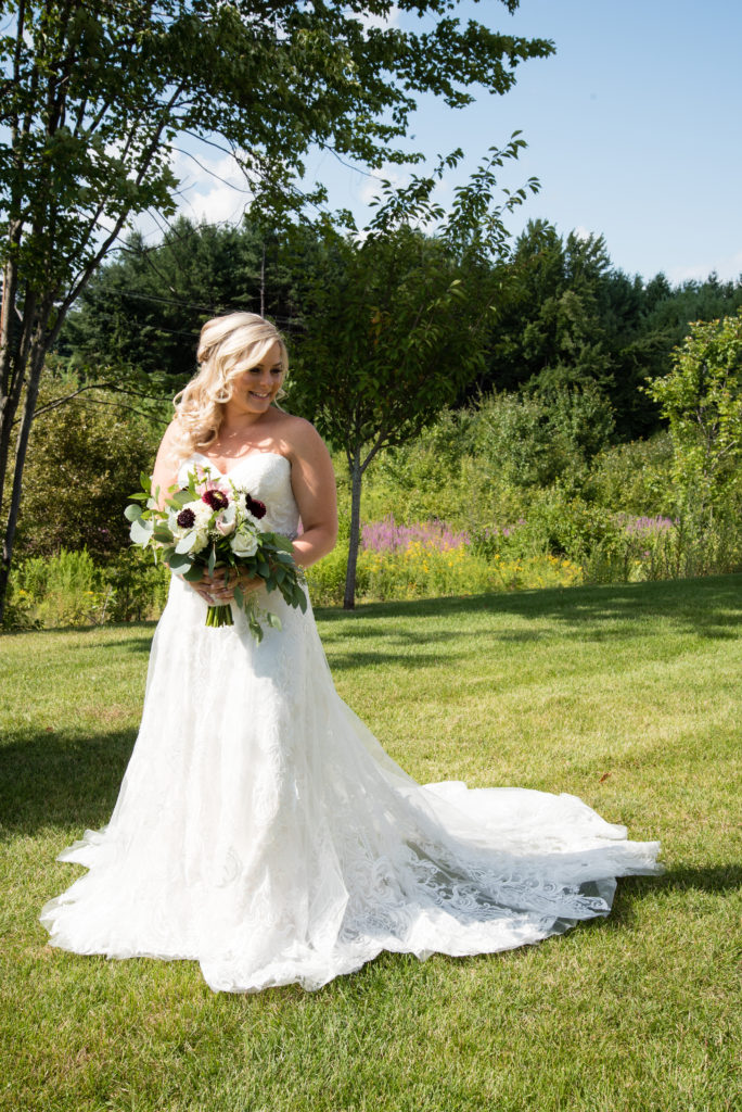 Bride with dress fanned out and bouquet