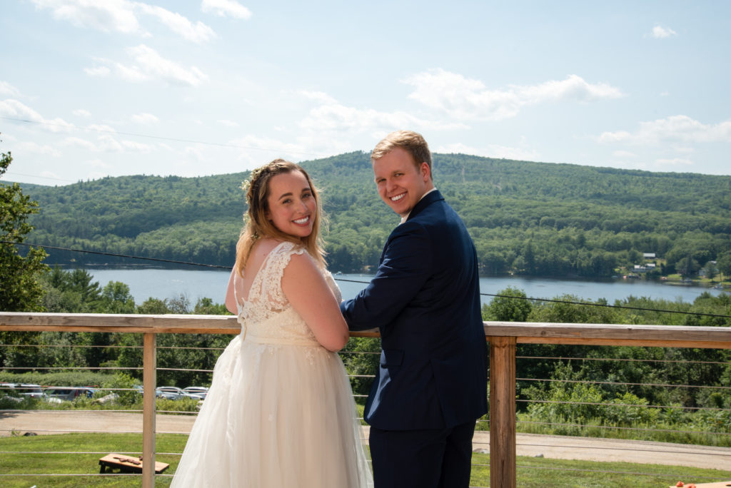 Bride and groom with lake view
