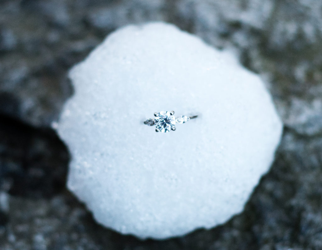 close of of engagement ring in a snowball