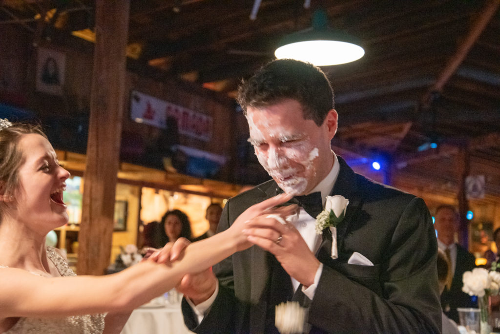 groom with a face of cake