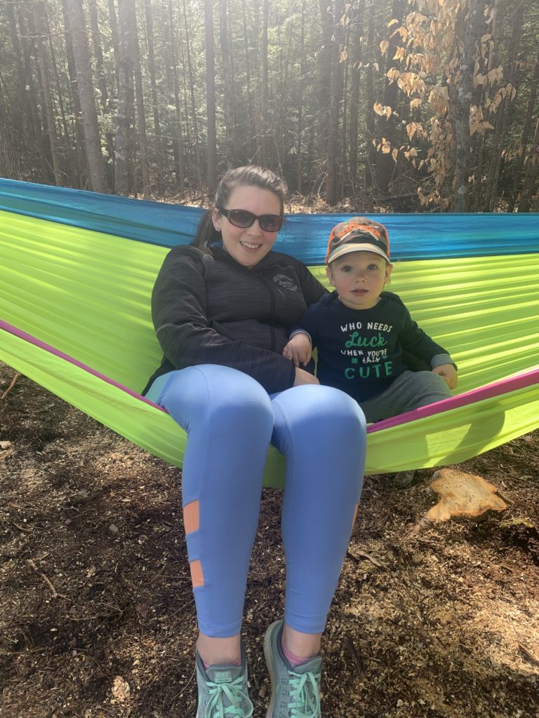mom and son sitting in hammock