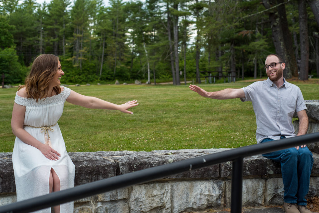 bride and groom 6 feet apart reaching for each other