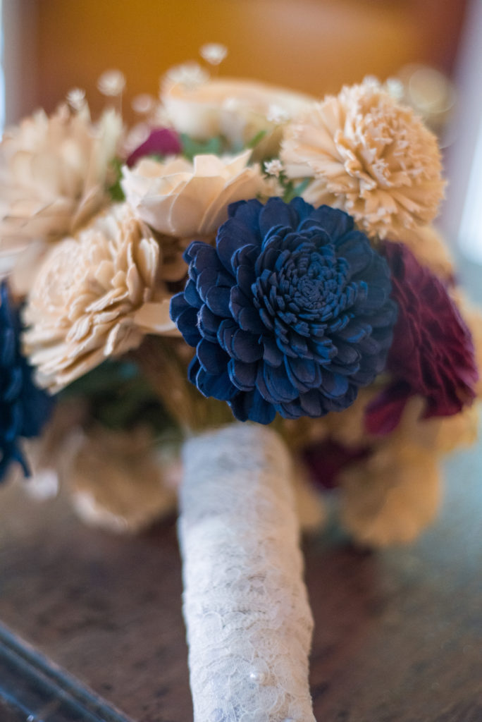 close up of bride's DIY bouquet of wooden flowers