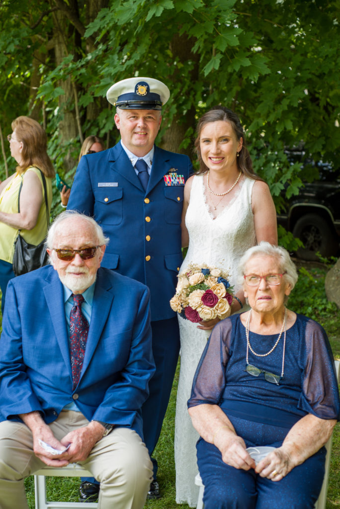 bride and groom with bride's grandparents without masks