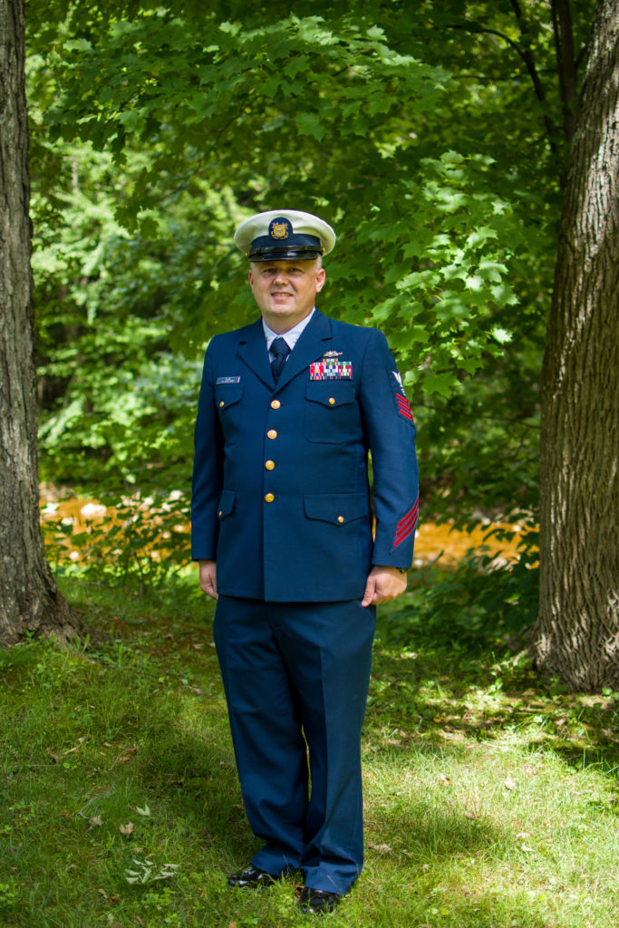 groom in his coast guard uniform standing at attention