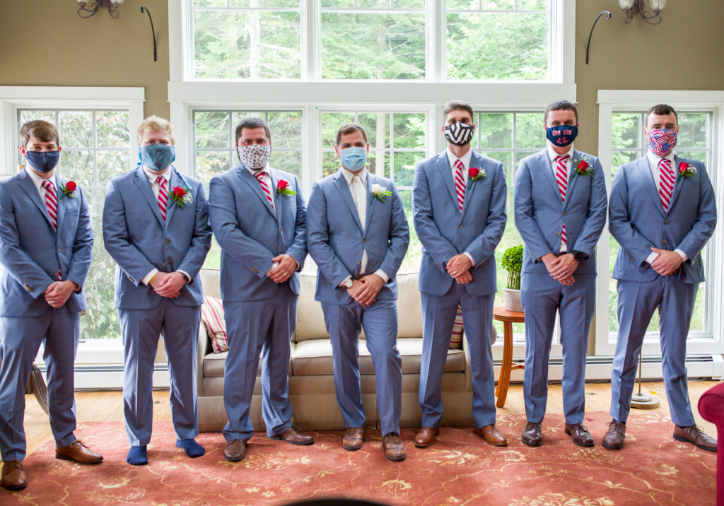 groom and his groomsmen wearing masks