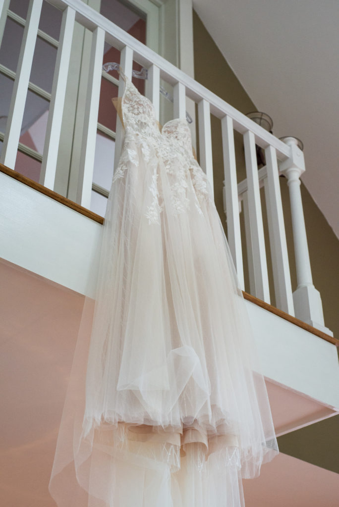 Bride's dress hanging from balcony