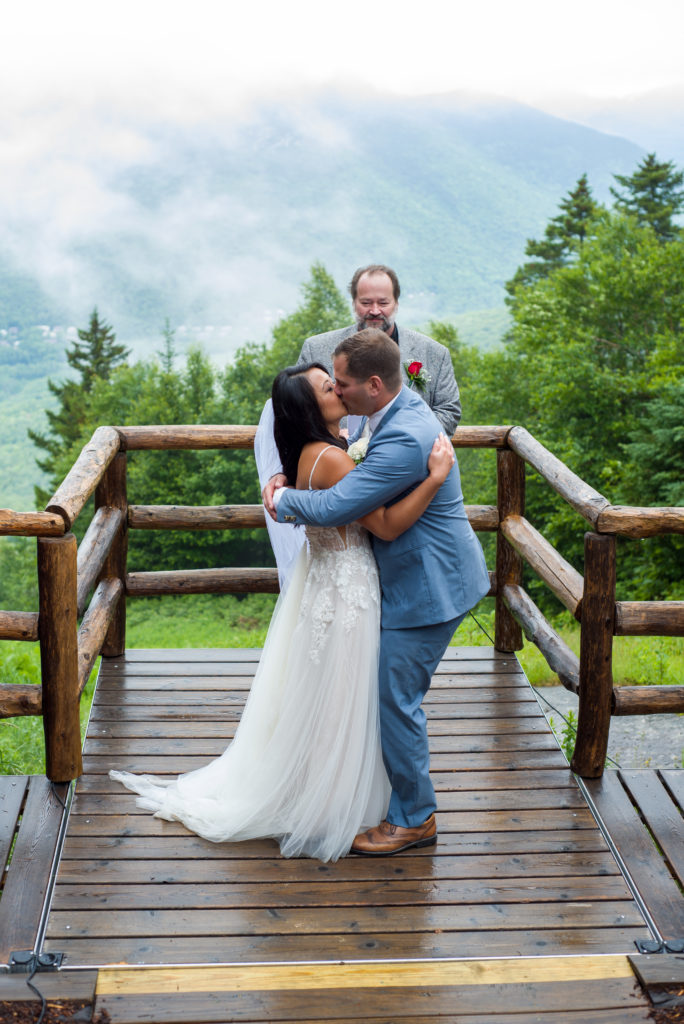 mountain top wedding first kiss