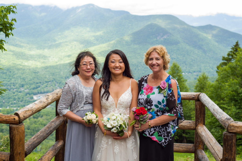 bride with her mom and mother-in-law at mountain top wedding