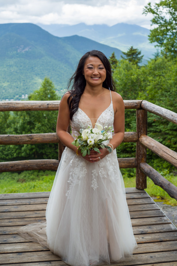 bride with her bouquet at mountain top wedding