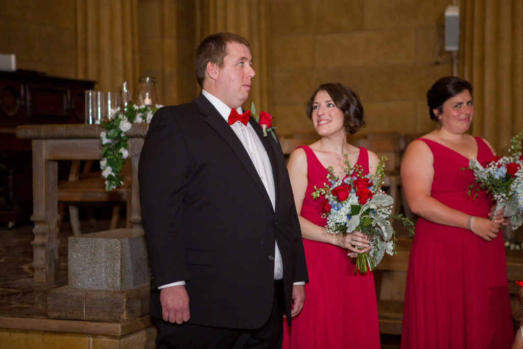groom waiting for her bride to walk down the aisle in the masonic temple