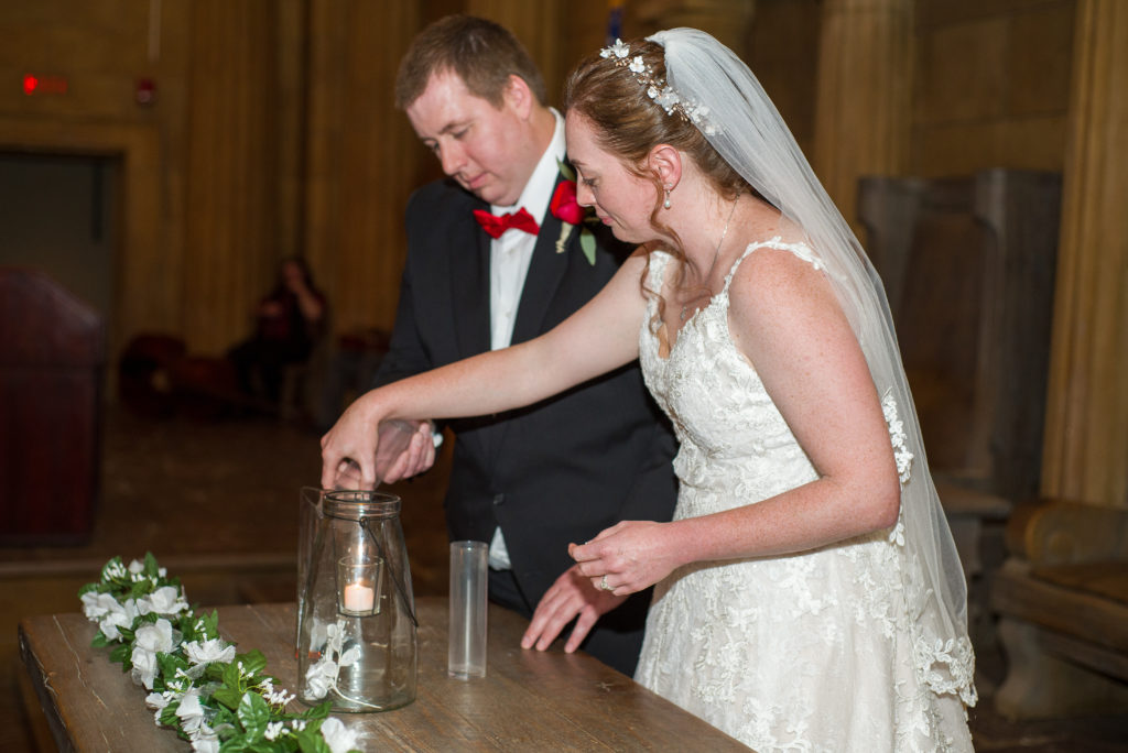 bride and groom mixing glass beads together in the masonic temple