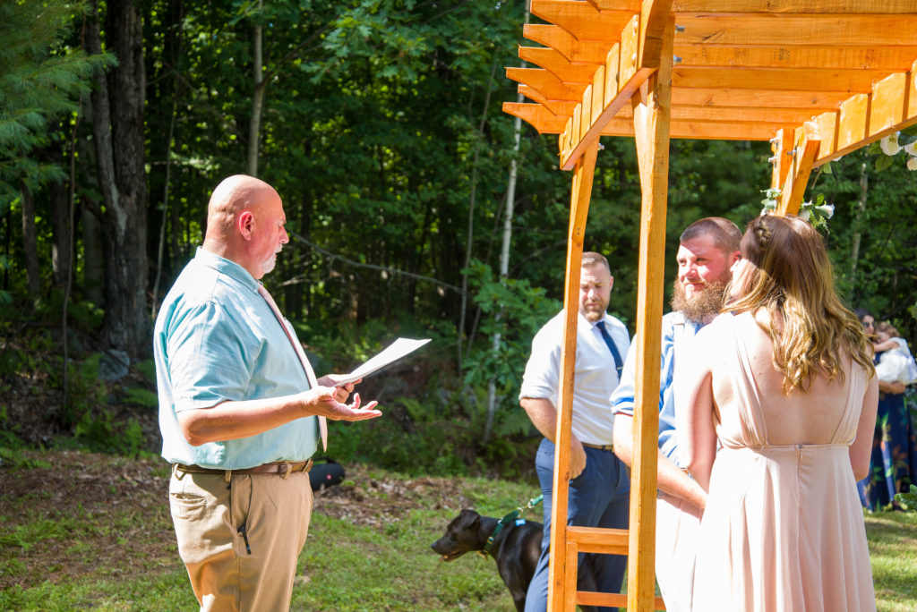 step dad marrying bride and groom during ceremony