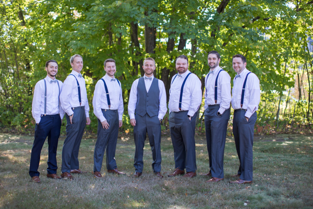 groom with his groomsmen outside at NH fall wedding
