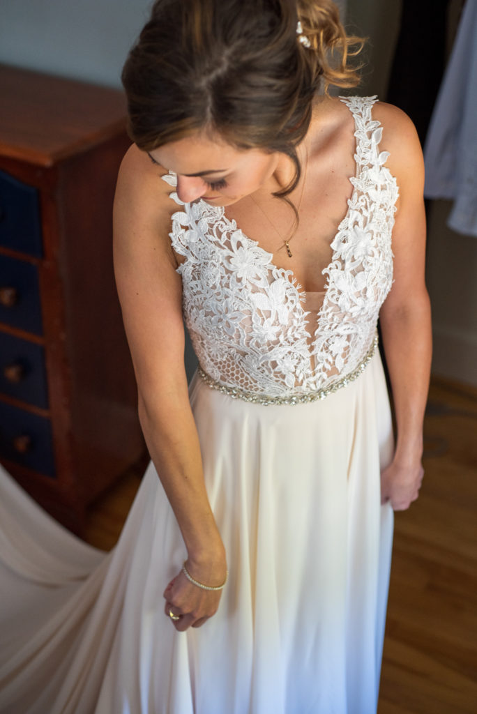 bride looking down at her dress