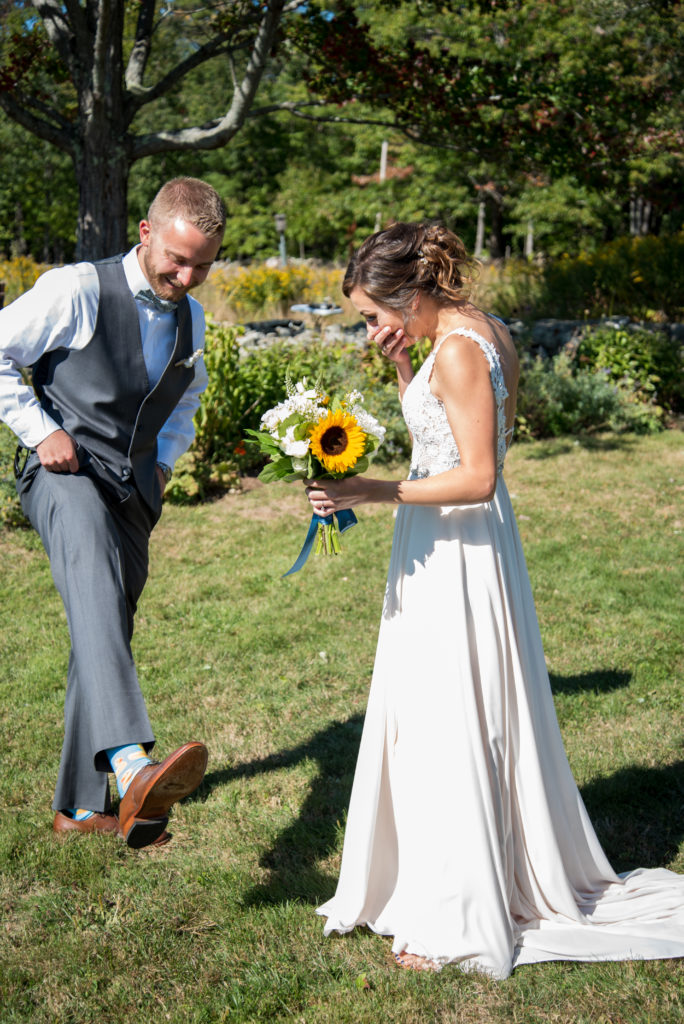 Groom showing bride his surprise rubber duck socks