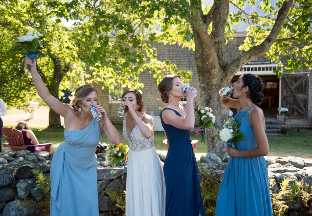 bride and her bridesmaids drinking together