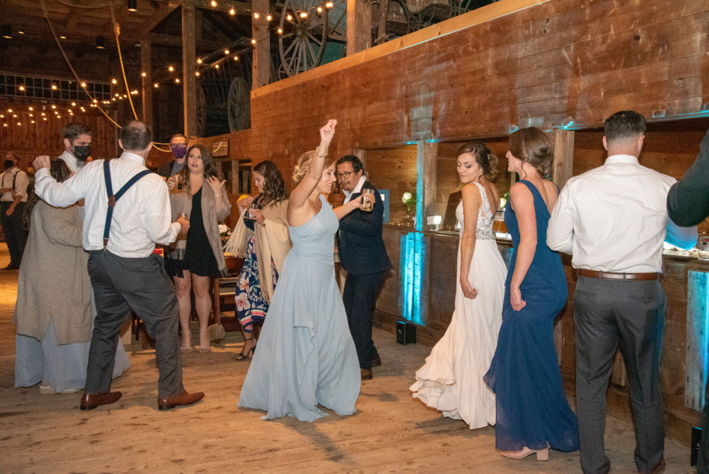 bride and her bridesmaids dancing the night away at Barn at Moody Mountain Farm Wedding