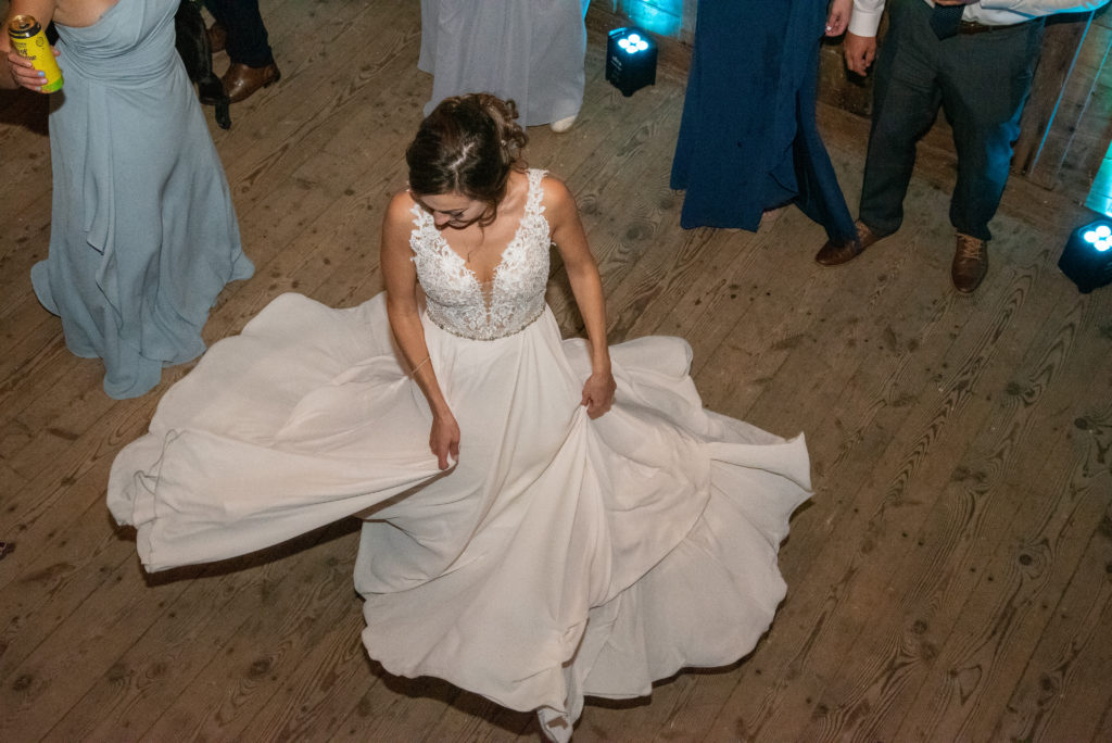 bride twirling in her dress, shot from up above on a balcony 