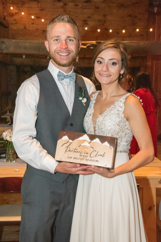 bride and groom holding their anniversary box that they will open in 10 years