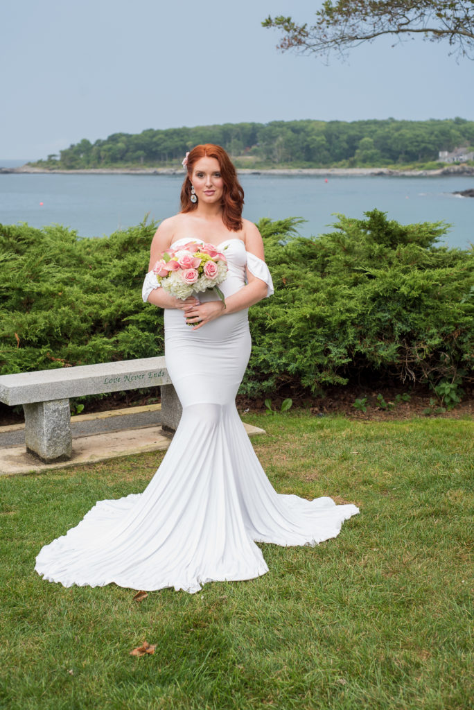 bride posing in park in front of ocean at York Harbor Inn elopement 