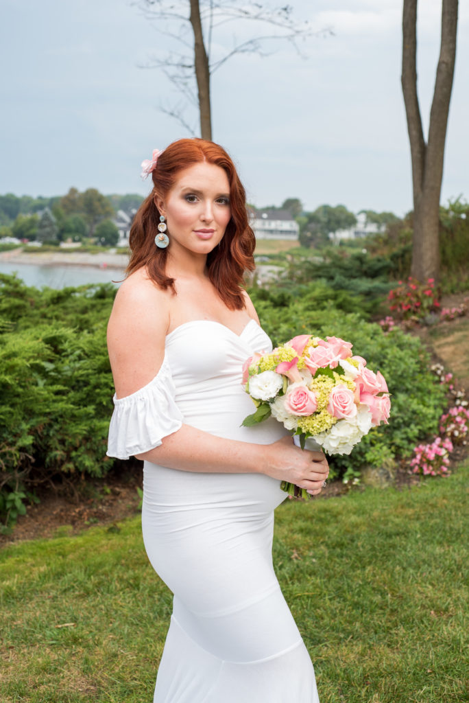 bride posing in park in front of ocean at York Harbor Inn elopement 