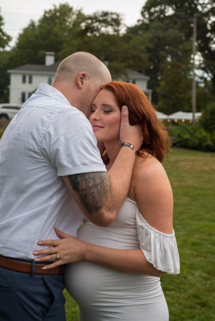 groom whispering vows into bride's ear at York Harbor Inn elopement