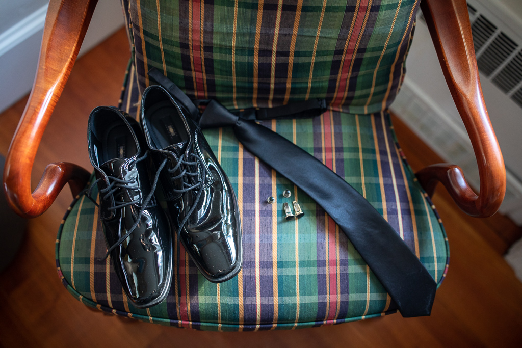 groom's wedding attire laid out on a chair