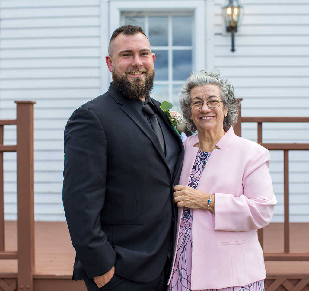 Groom and his mom smiling