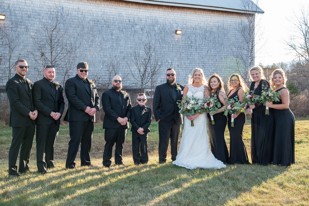 bridal party standing in front of the barn at Whitney Farm Estate