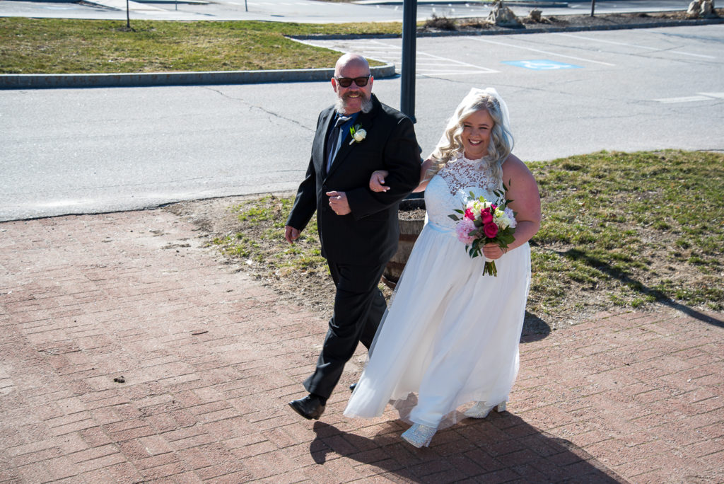 Bride and her dad walking to gazebo 