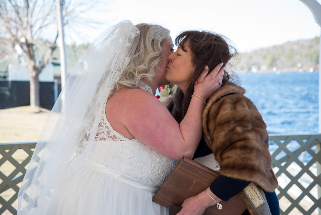 bride kissing her mom
