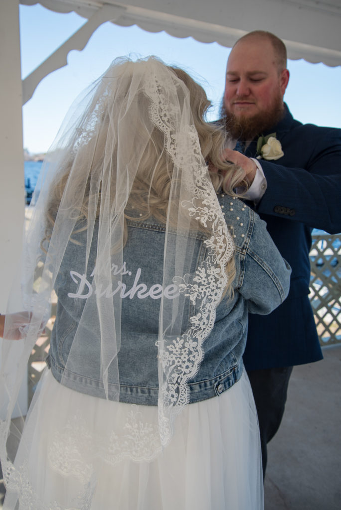 bride's new denim jacket with her new last name