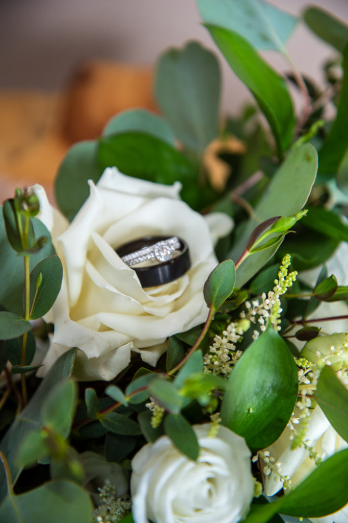 wedding rings in the rose of the bridal bouquet