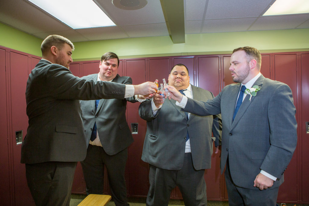 groom and his guys cheers at a summer loving wedding